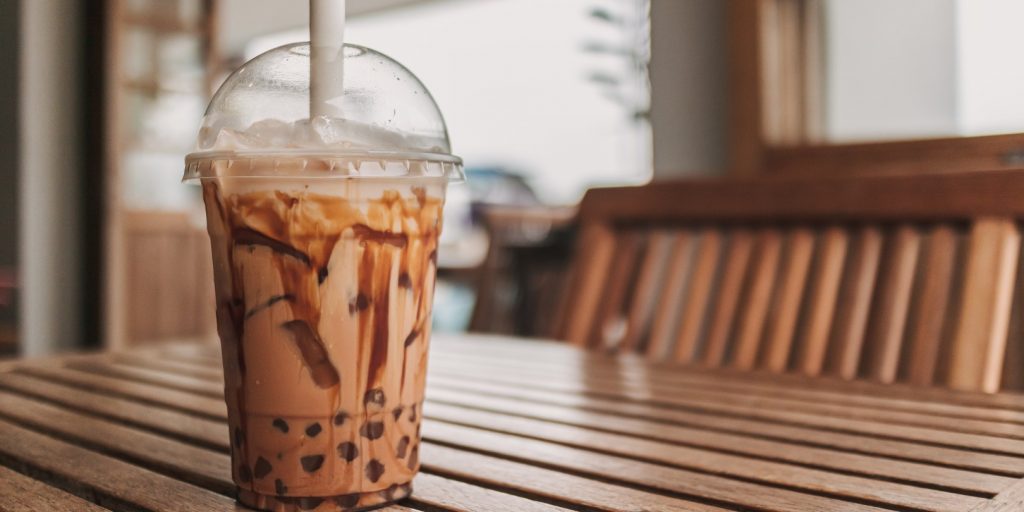 Iced Cocoa Boba Bubble Tea Served on Table in the Cafe.