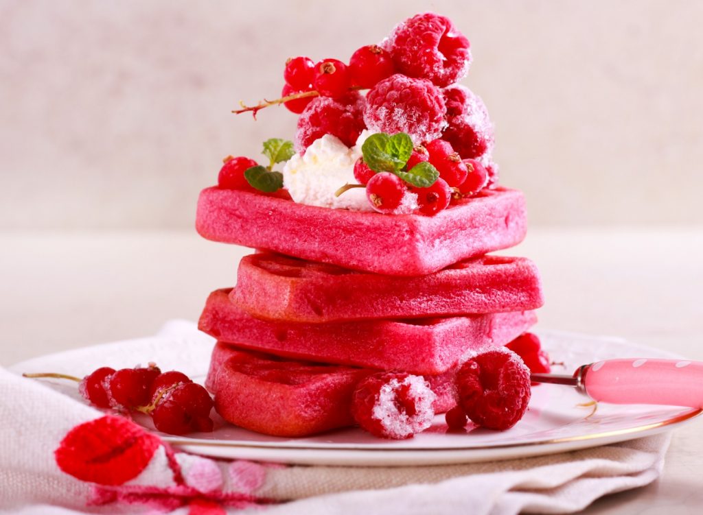 Red velvet waffles topped with berries