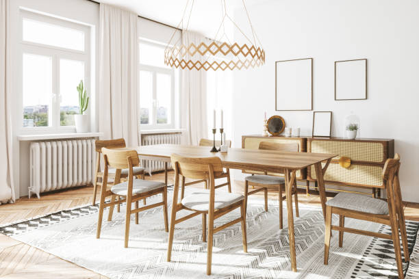 Interior of Scandinavian style dining room with dining chair cushions on the wooden chairs.